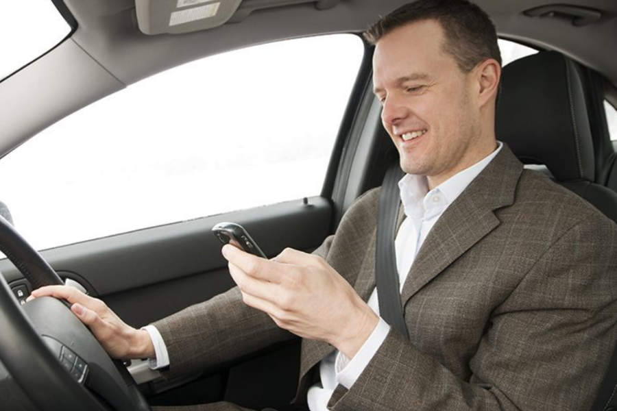 What should be included in a driving at work risk assessment? Car driver using mobile phone on business